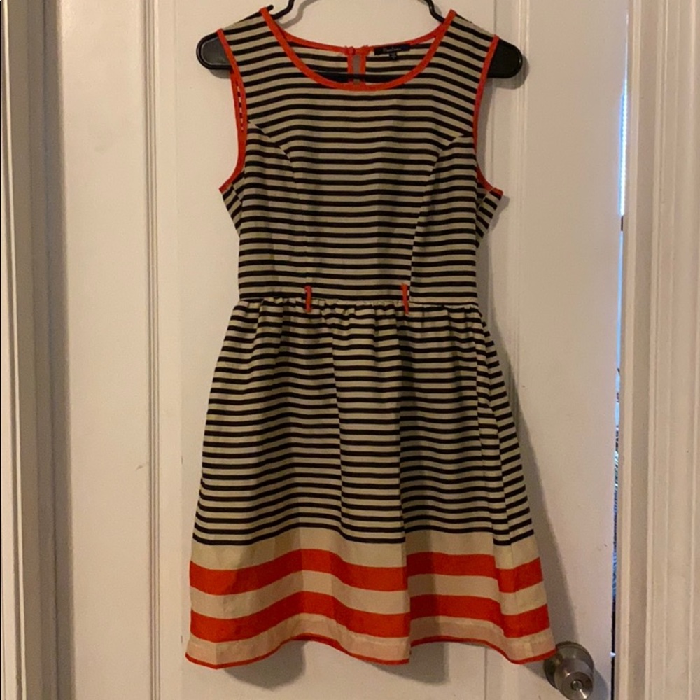 Gently worn cream, black and orange striped dress